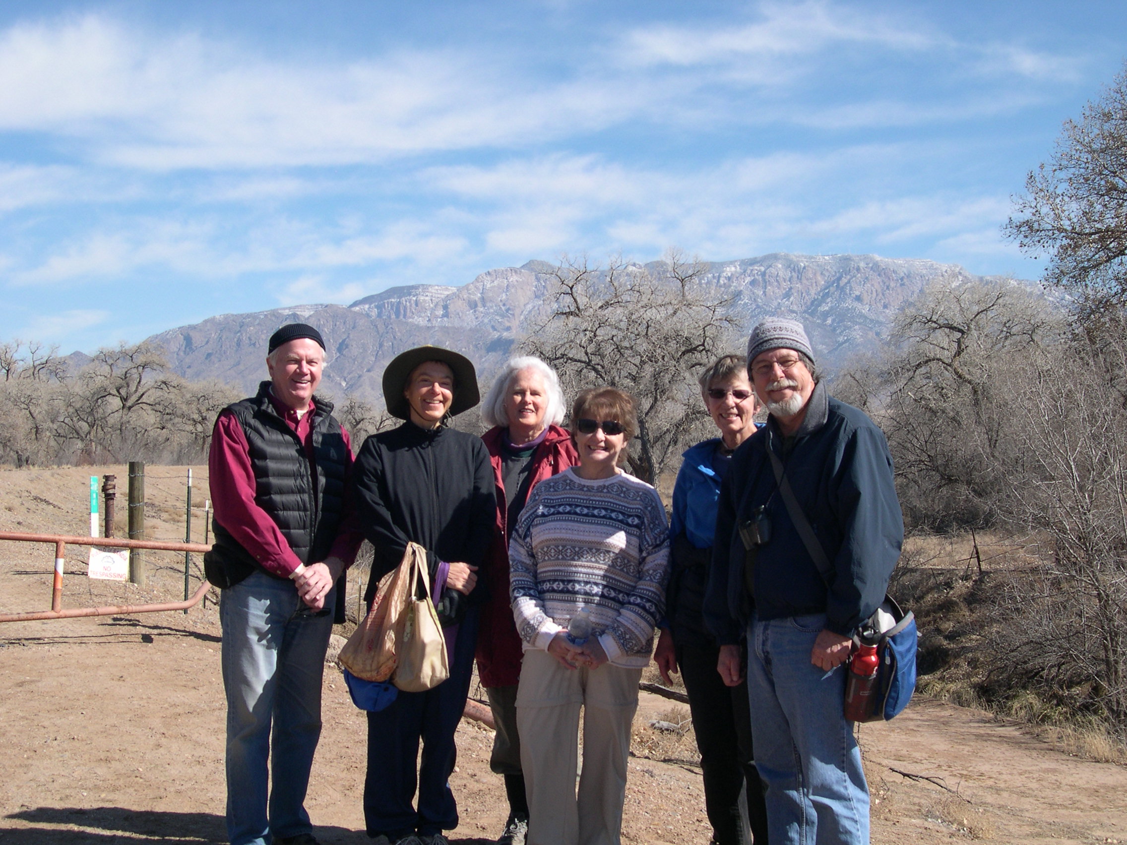 Hikers - Rick Held, Heather Gram, Kathleen Rhoad, Pam Bliss, Dawn Leach, Scott Lake (left to right) next to the Sandia border gate